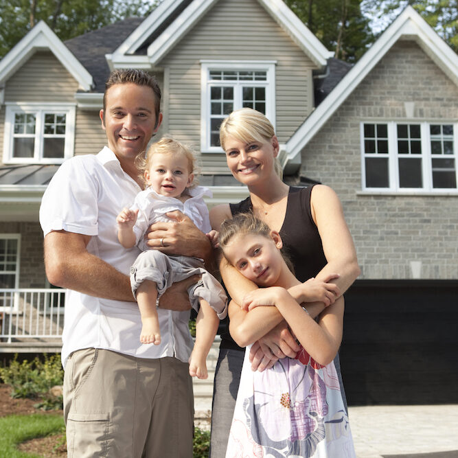 home-with-happy-family happy family in front of house